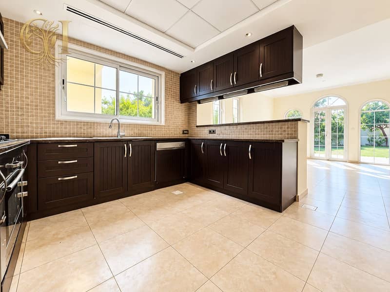 7 Sunlit Espresso Kitchen with Garden Views. png
