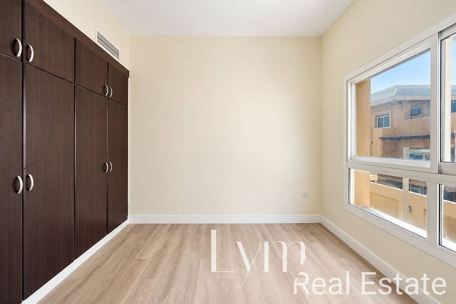 8 Modern Empty Bedroom with Dark Wood Wardrobe. png