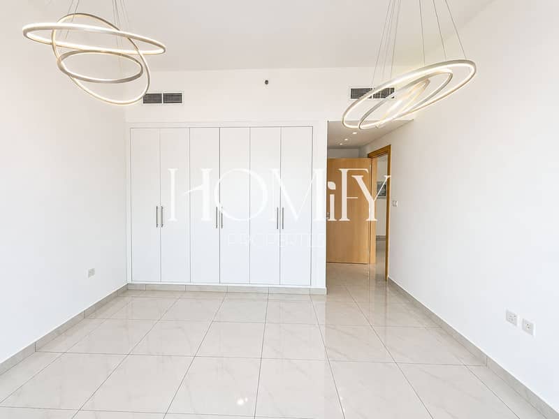 5 Bright Minimalist Room with Ring Chandeliers. png
