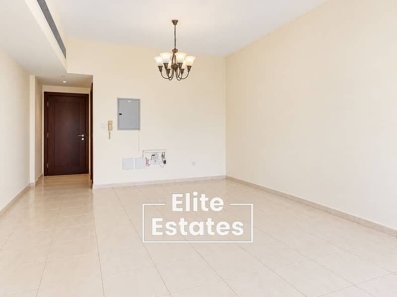 3 Empty Cream-Tiled Room with Chandelier. png