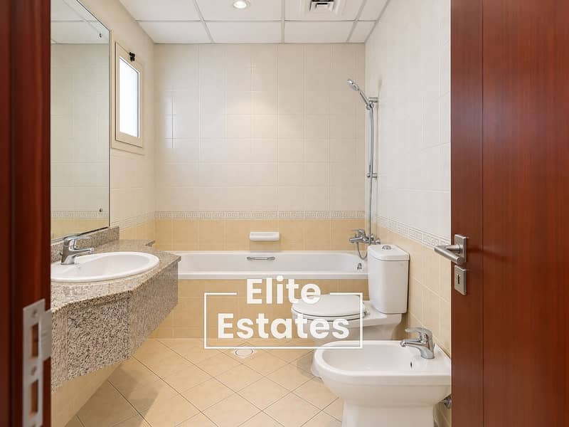 9 Modern Beige Tiled Bathroom Interior. png