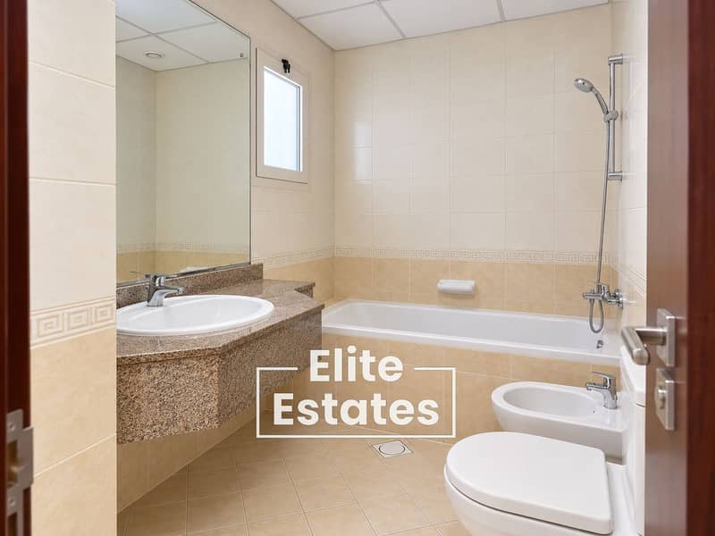 11 Modern Beige Tiled Bathroom. png