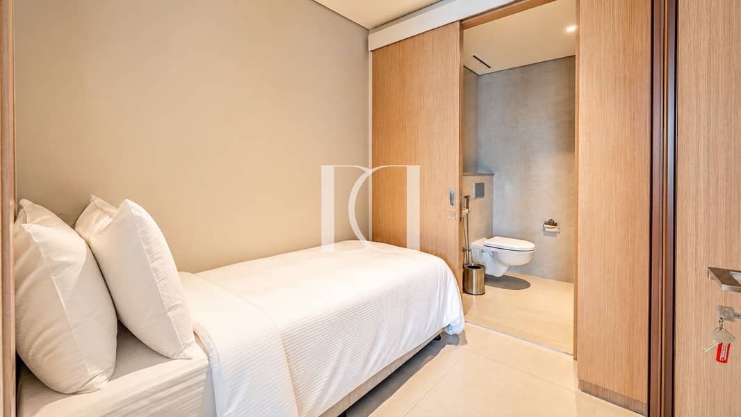 13 Modern Neutral Bedroom with Ensuite Bathroom. png
