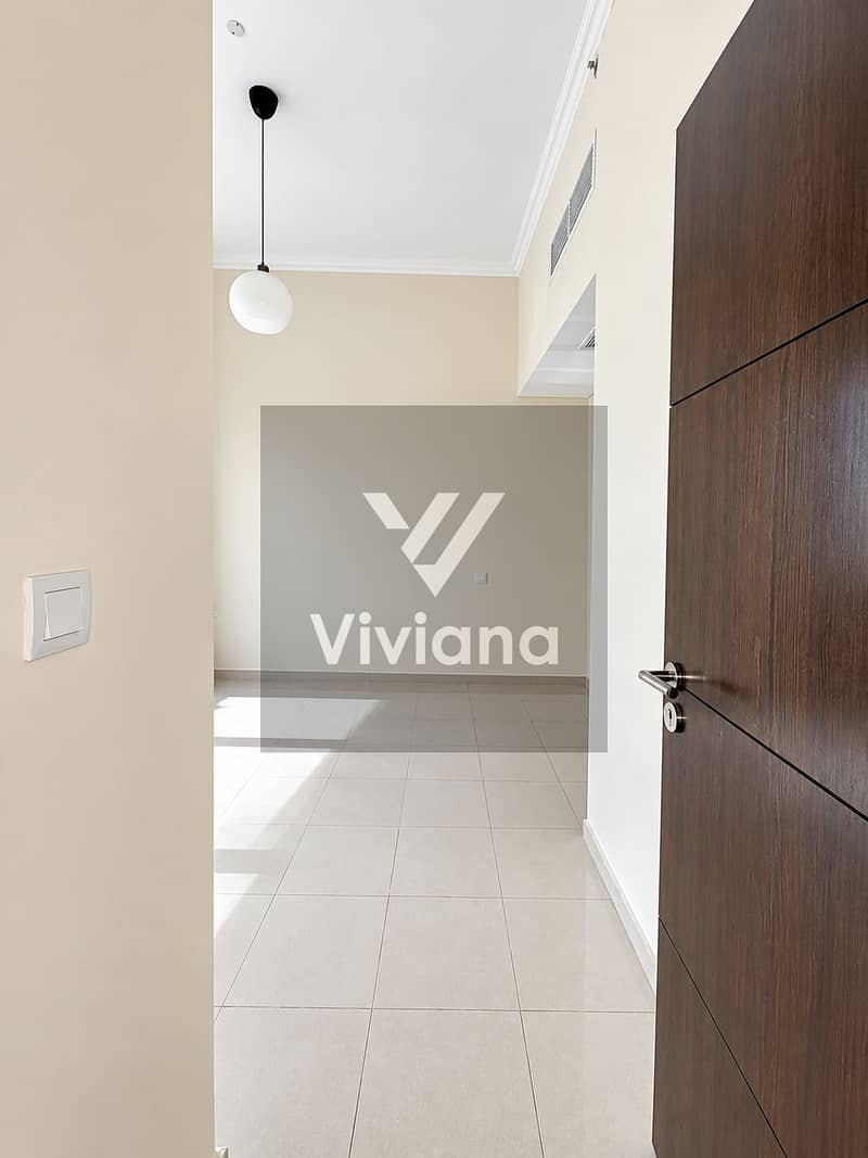 12 Sunlit Minimalist Room with Open Door. png