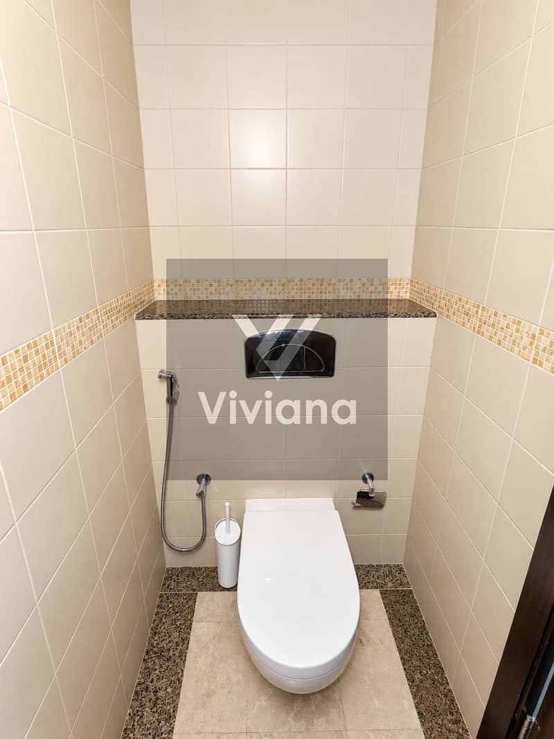 16 Modern Beige Tiled Restroom Stall. png