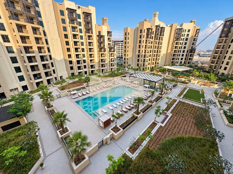 Sunlit poolside residence with modern balconies. png Sunlit poolside residence with modern balconies. png