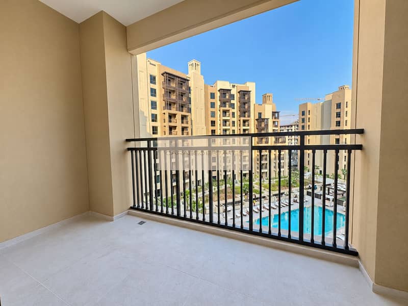 2 Bright balcony with courtyard pool views. png