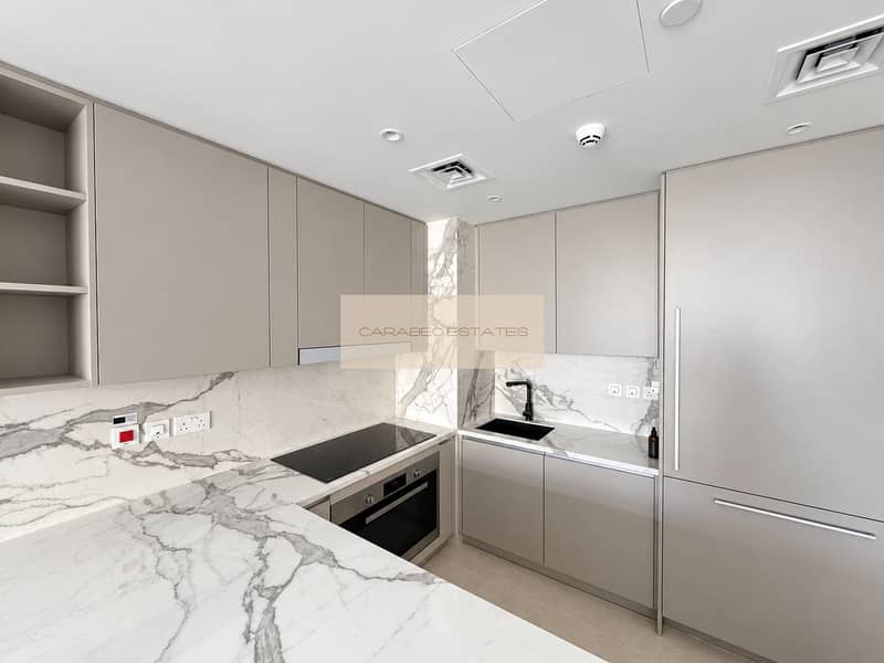 6 Bright, polished gray kitchen with marble. png