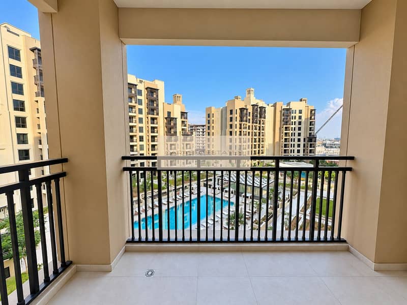 10 Bright Balcony Overlooking Pool Courtyard. png