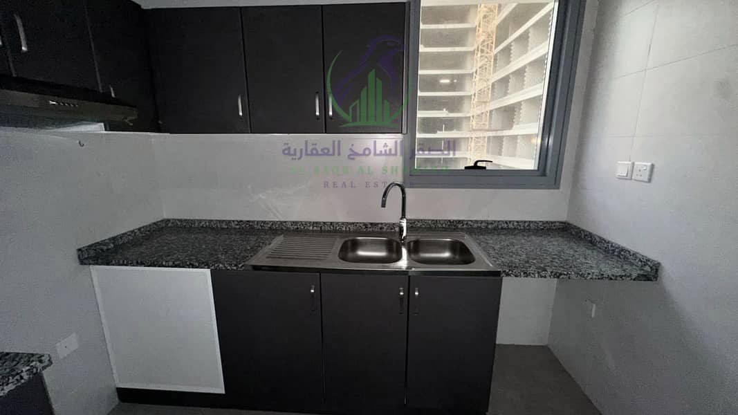 12 apartment-for-rent-2-bedroom-almjaz2-alsharqh-kitchen-04. jpg