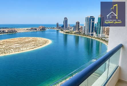 3 Slaapkamers Appartement te Huur in Al Khan, Sharjah - Balcony View of Coastal Skyline and Lagoon. png