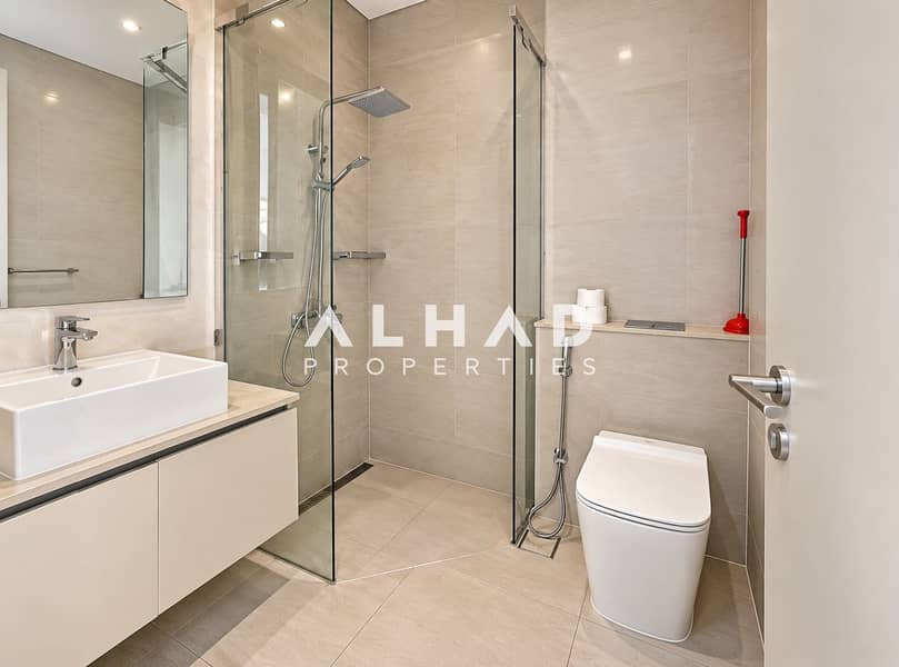 8 Modern Beige Bathroom with Glass Shower. png