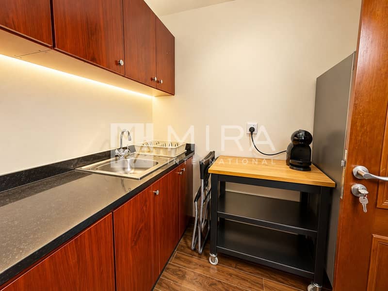 13 Modern Wood-Toned Kitchenette with Coffee Station
