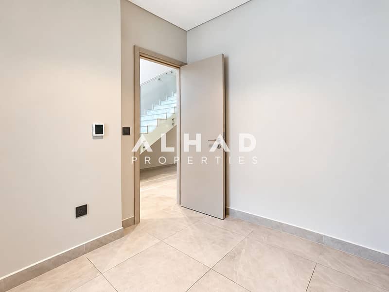 12 Minimalist Hallway with Open Stairway Door (1). png