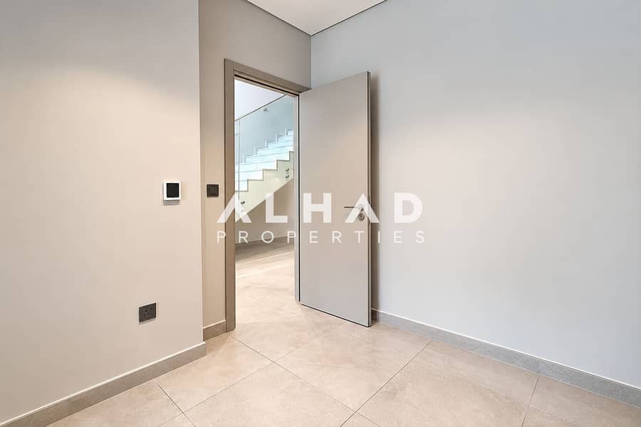 14 Minimalist Hallway With Open Stairway Door. png