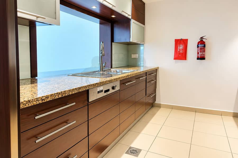 4 Modern Galley Kitchen with Safety Equipment. png