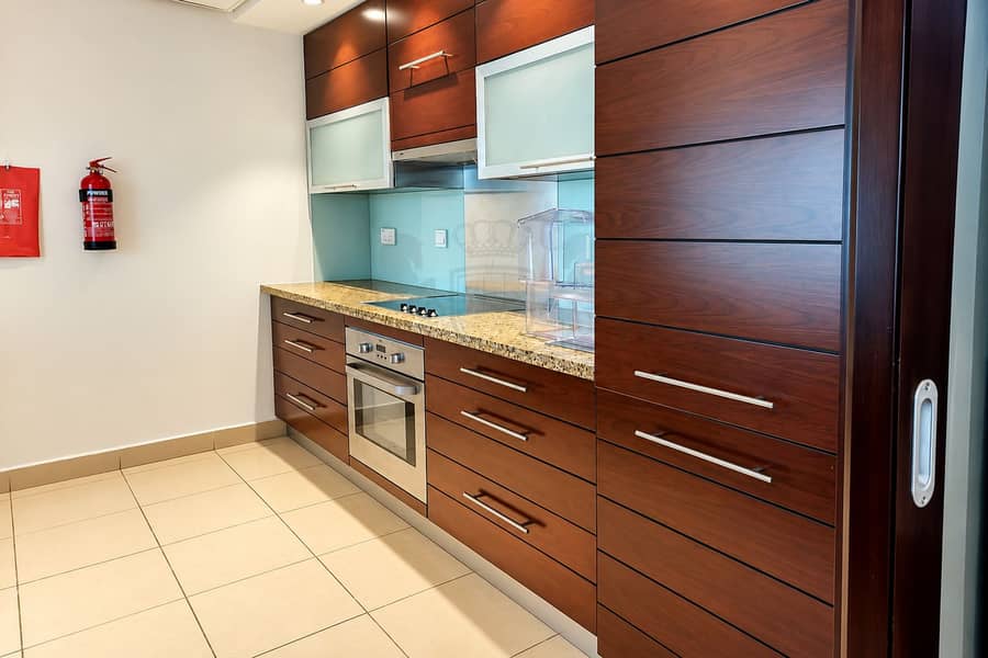7 Modern Galley Kitchen with Fire Safety Station. png