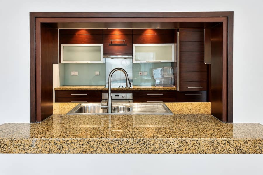 12 Modern Kitchen Pass-Through with Granite Breakfast Bar. png