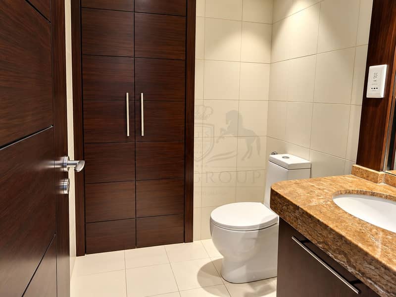 15 Modern Walnut-Toned Bathroom Interior. png