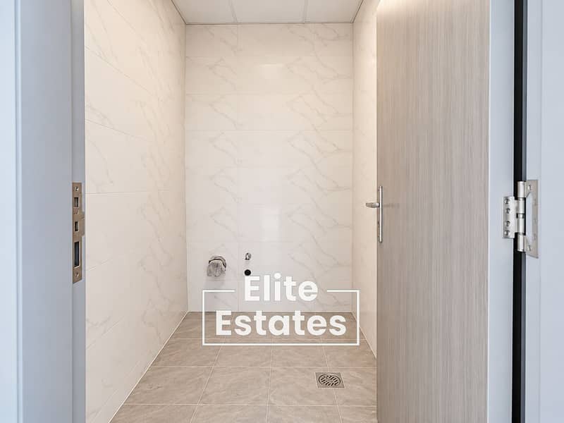 8 Bright Minimal Utility Bathroom with Marble Tiles. png