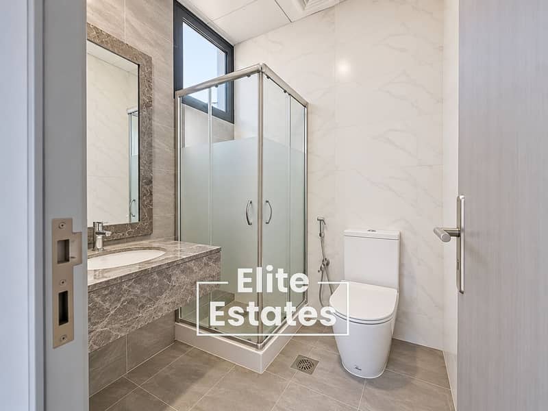 9 Contemporary Marble-Tiled Bathroom. png