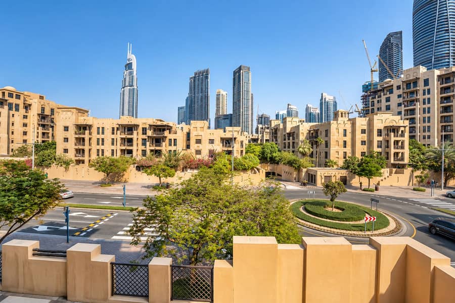 15 Dubai Skyline Above a Green Roundabout. png