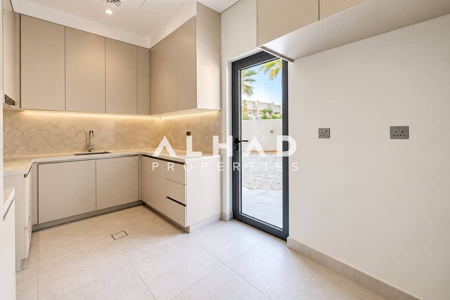 12 Minimalist Beige Kitchen with Garden View. png