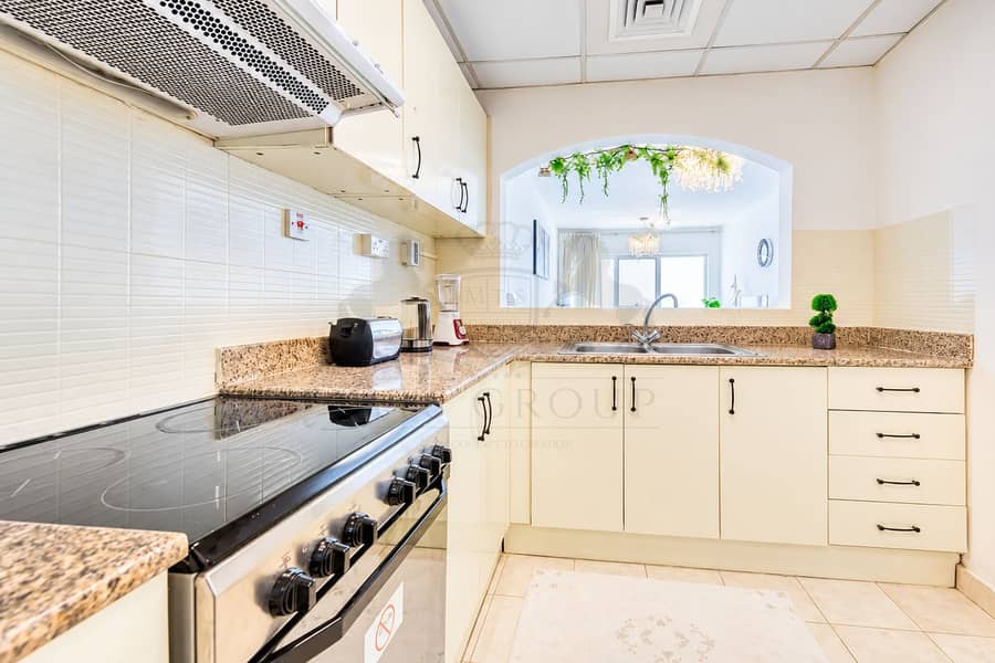 10 Bright Modern Kitchen with Arched Pass-Through. png