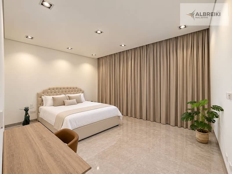 14 Minimalist Bedroom with Curved Headboard and Draped Window. png