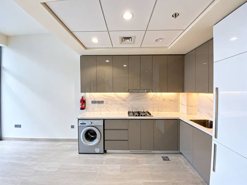 4 Modern Taupe Kitchen with Marble Accents. png