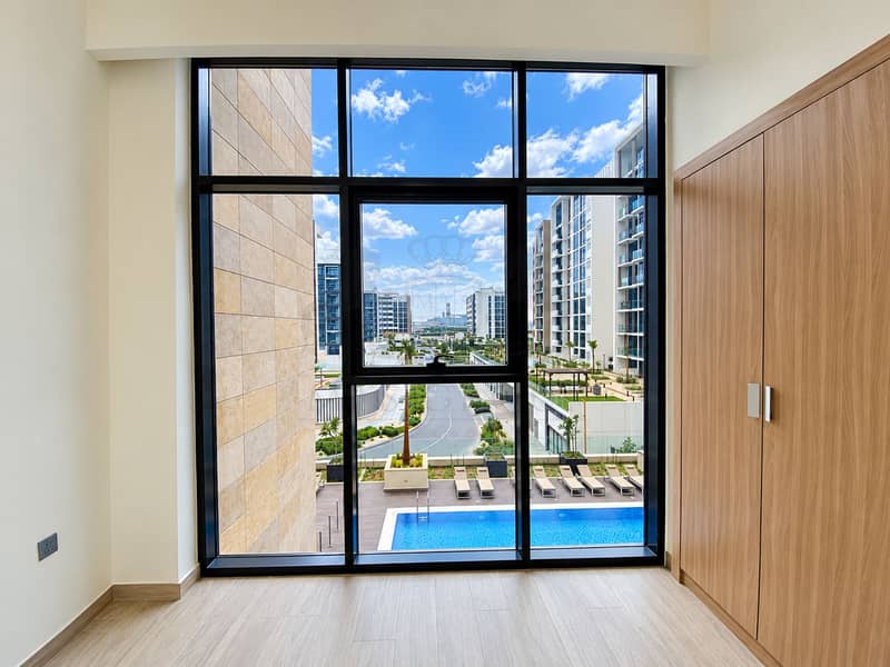 5 Modern Room with Poolside Skyline View. png