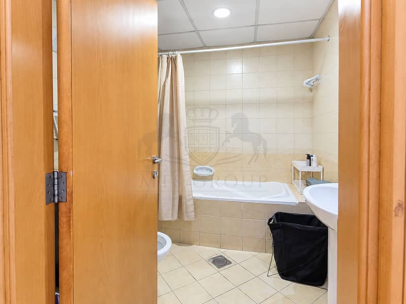 10 Bright Beige Bathroom Through Open Door. png