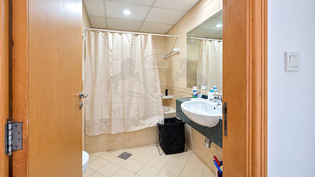 11 Bright Compact Beige Tile Bathroom. png