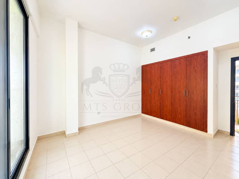 2 Bright Minimalist Room with Wooden Wardrobe. png