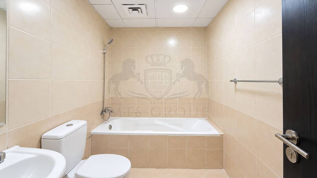 8 Modern Beige Bathroom with Bathtub. png