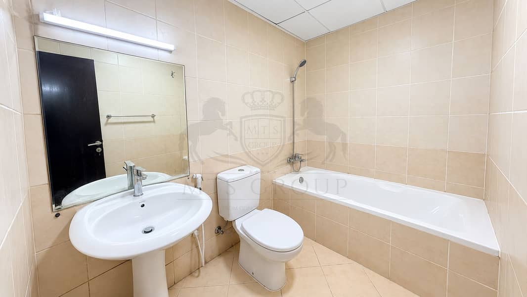 9 Bright Minimalist Beige-Tiled Bathroom. png