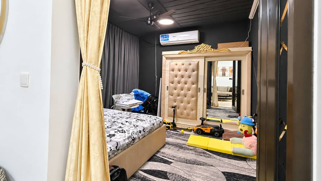 4 Warmly Lit Modern Bedroom Interior. png