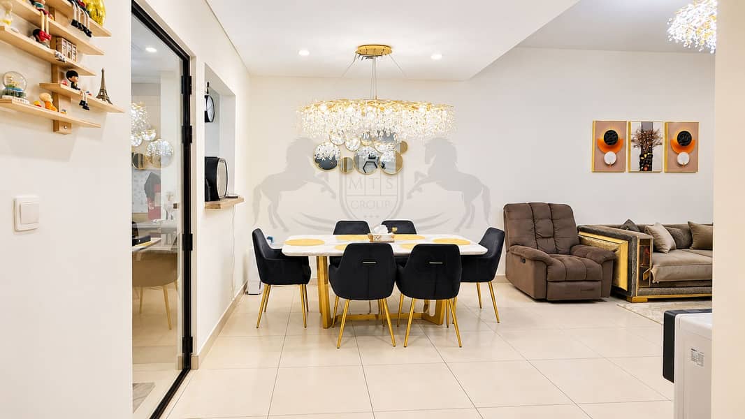9 Modern Gold-Accented Dining and Living Room. png