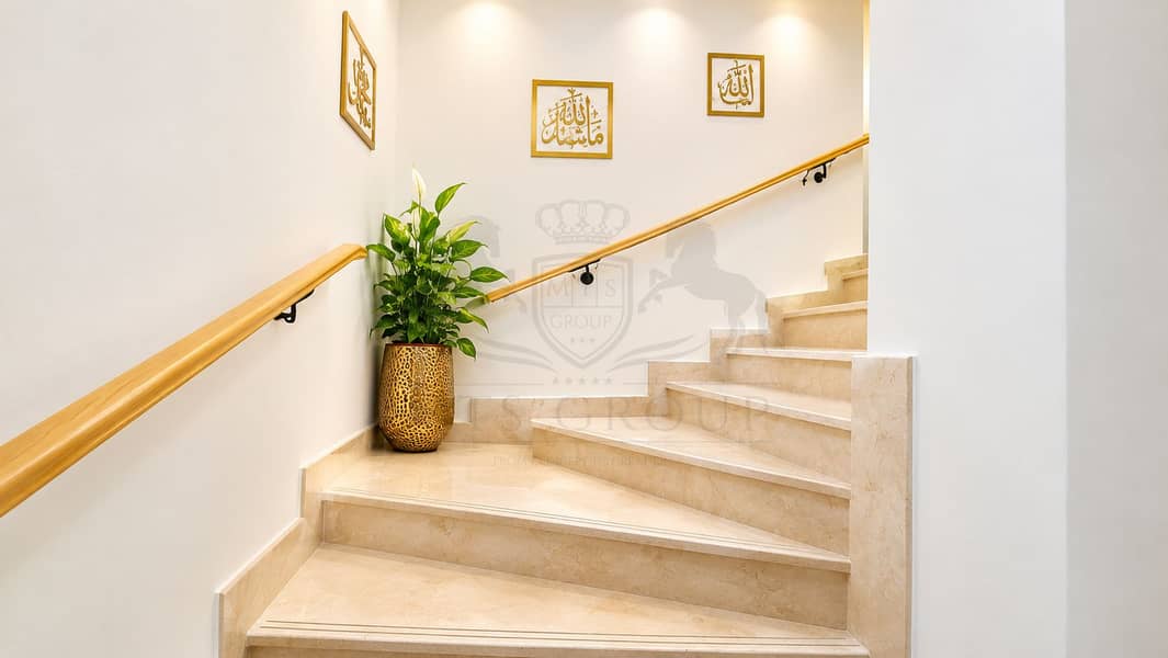 11 Elegant Marble Stairwell with Islamic Calligraphy. png
