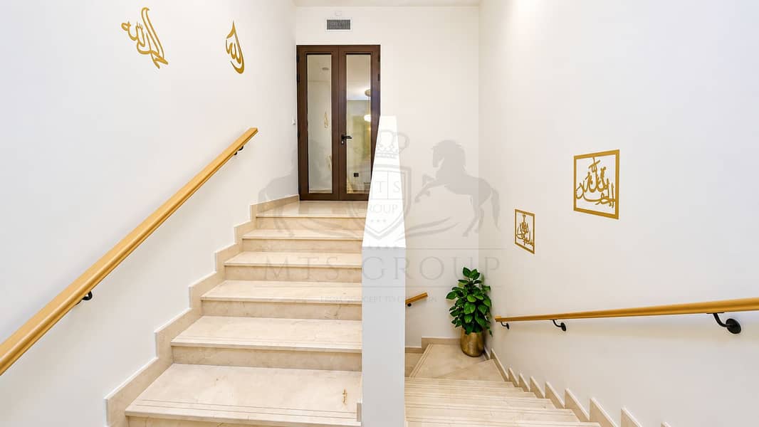 13 Elegant Gold-Accented Marble Stairwell. png