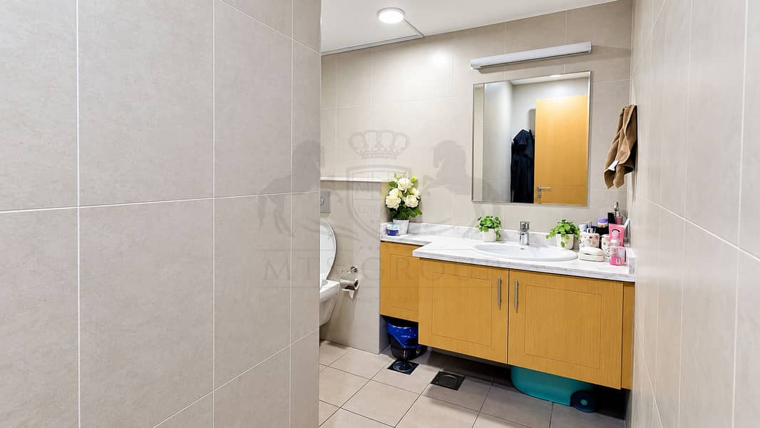 18 Modern Beige-Tiled Bathroom Vanity. png