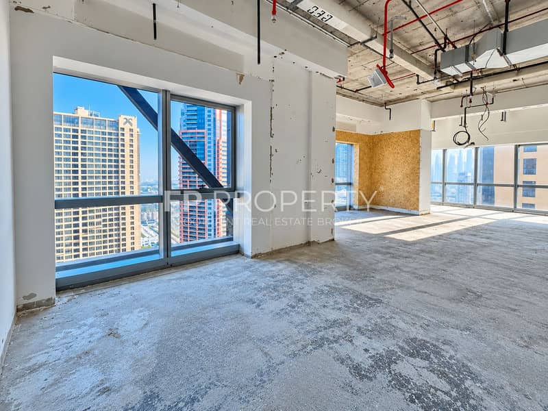 3 Sunlit Unfinished Office with Skyline Views. png