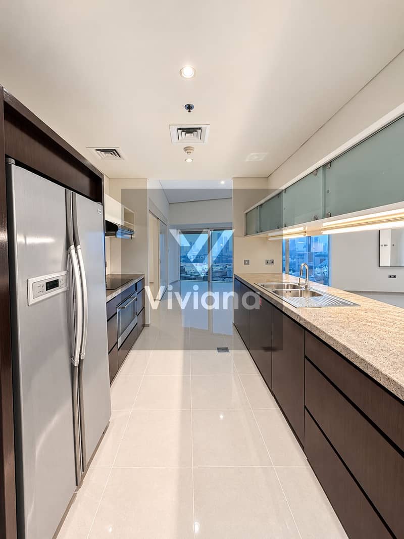 9 Modern Galley Kitchen with City Views. png