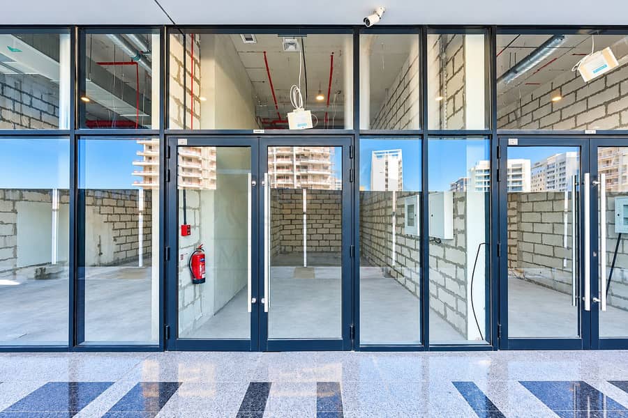 3 Modern Glass Storefront with Unfinished Interior. png
