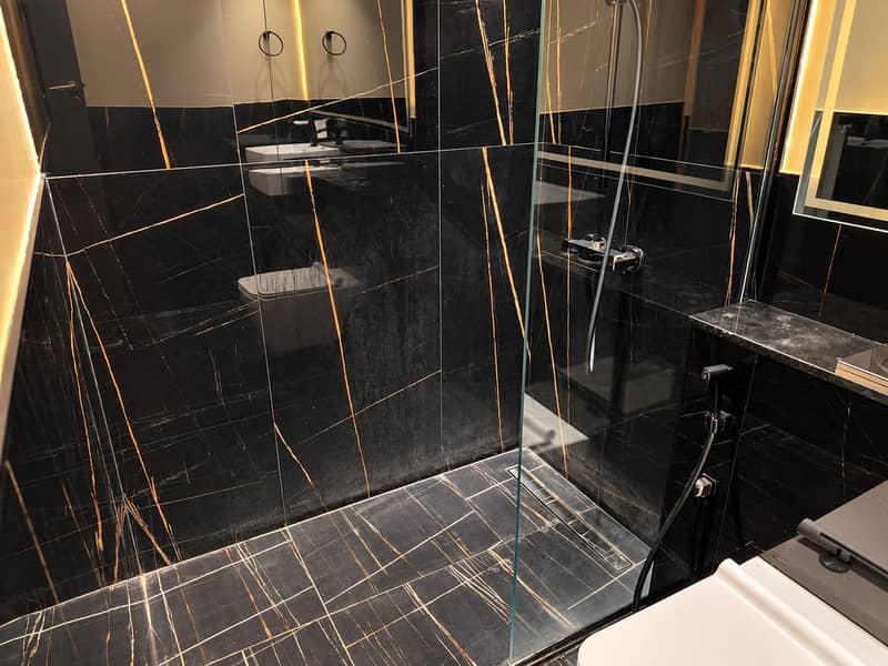 11 Luxurious Black Marble Shower Interior. png