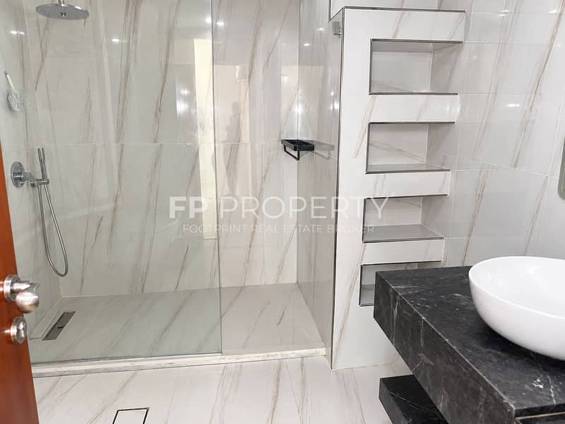 8 Modern Marble Bathroom with Glass Shower. png
