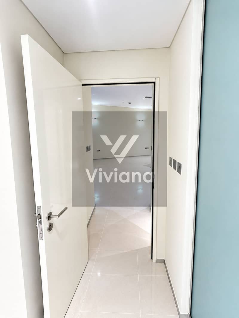 6 Modern Hallway Opening to Light-Filled Room. png