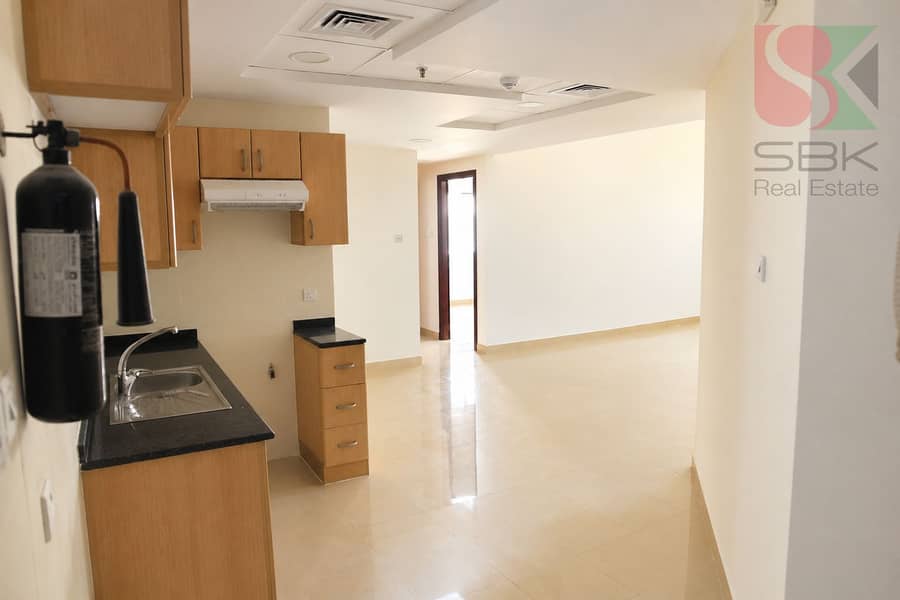 2 Warmly Lit Empty Studio Kitchenette. png