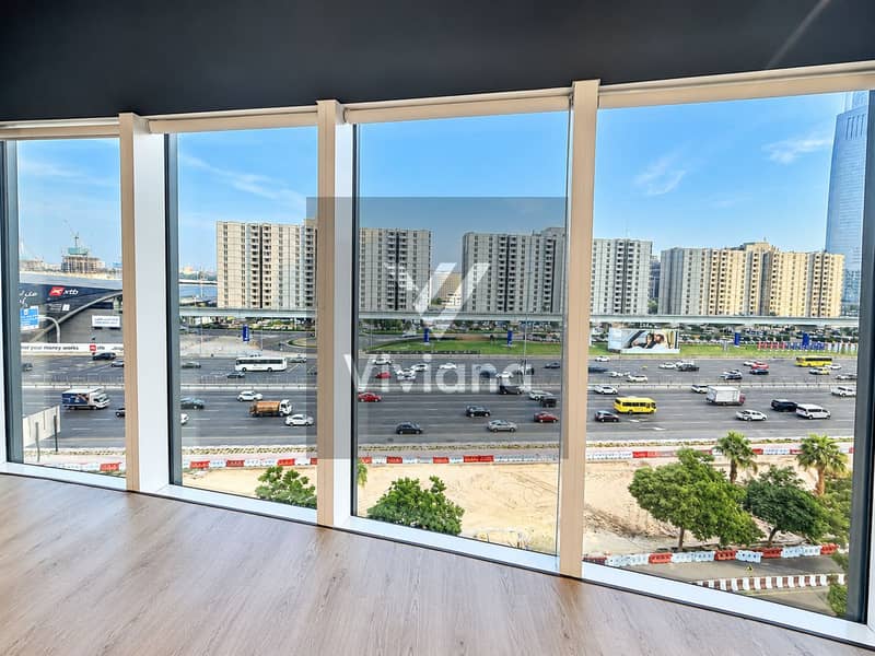 3 Modern Office Windows Overlooking City Highway. png