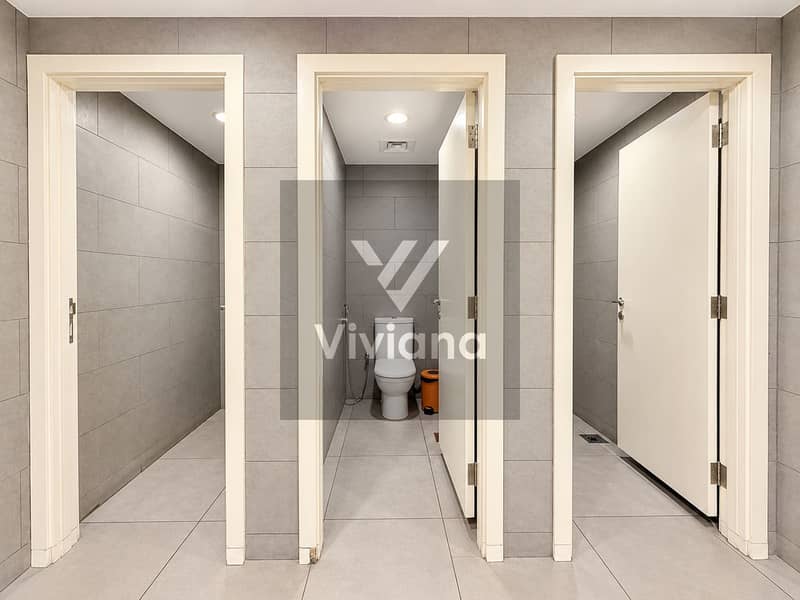 36 Modern Symmetrical Tiled Restroom Corridor. png